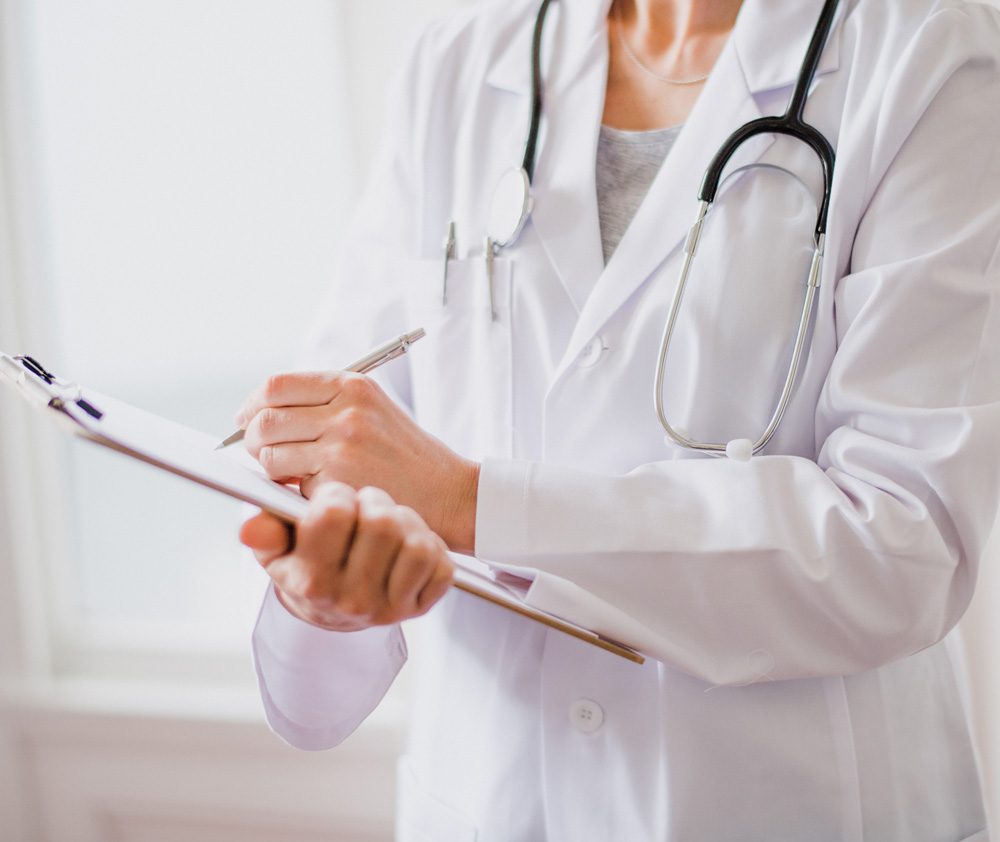 doctor-writing on clipboard